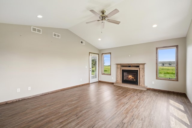 1516 Ranger Dr, Glencoe, MN 55336 - unfurnished living room with plenty of natural light, wood finished floors, vaulted ceiling, a premium fireplace, and recessed lighting