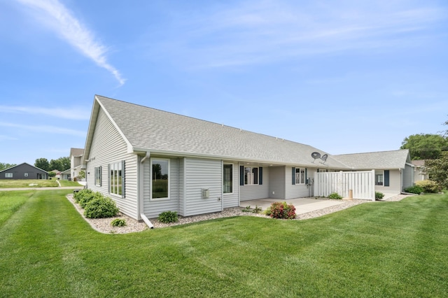 1516 Ranger Dr, Glencoe, MN 55336 - back of property featuring a patio, a yard, and roof with shingles