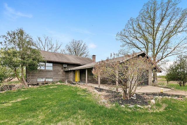 19867 Twin Lakes Rd, Darling Twp, MN 56345 - view of front of home with an attached garage, a chimney, a front yard, and driveway