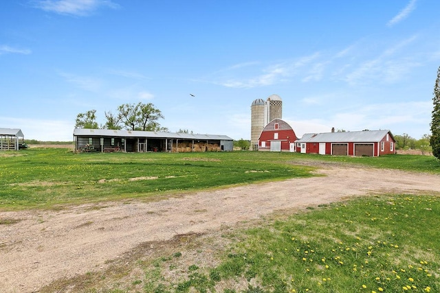 19867 Twin Lakes Rd, Darling Twp, MN 56345 - exterior space with driveway, a barn, an outdoor structure, and a detached garage