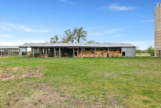 19867 Twin Lakes Rd, Darling Twp, MN 56345 - rear view of property featuring a pole building, an outdoor structure, and a lawn