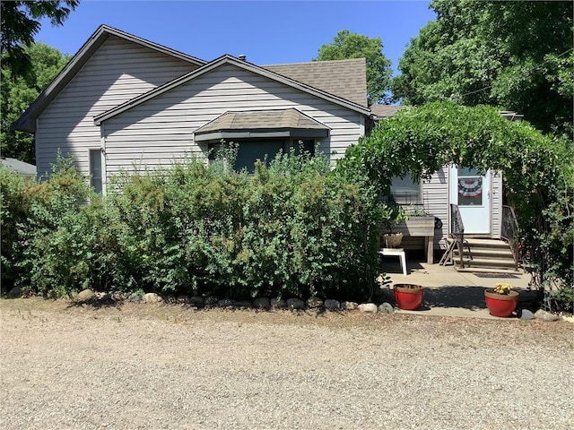 103 Bloomer St E, Morristown, MN 55052 - view of front of home featuring entry steps and a shingled roof