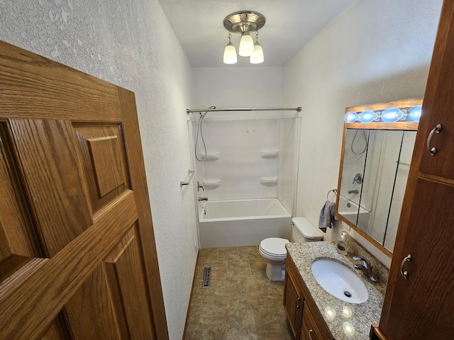 103 Bloomer St E, Morristown, MN 55052 - full bath with a textured wall, toilet, vanity, and shower / washtub combination
