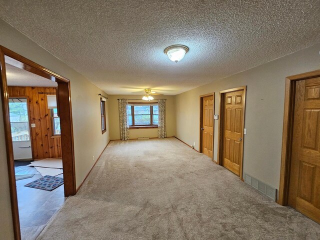 103 Bloomer St E, Morristown, MN 55052 - spare room featuring ceiling fan, a textured ceiling, and carpet