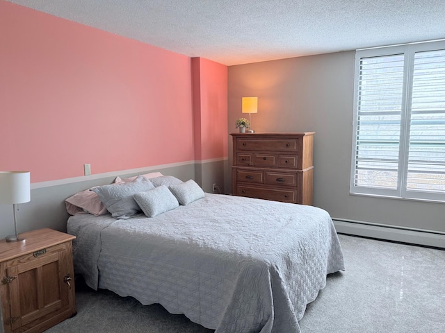 6615 Lake Shore Dr S Unit 415, Richfield, MN 55423 - carpeted bedroom featuring a baseboard heating unit and a textured ceiling