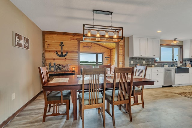 21048 Eagle Dr, Leslie Twp, MN 56360 - dining space featuring wood walls and baseboards