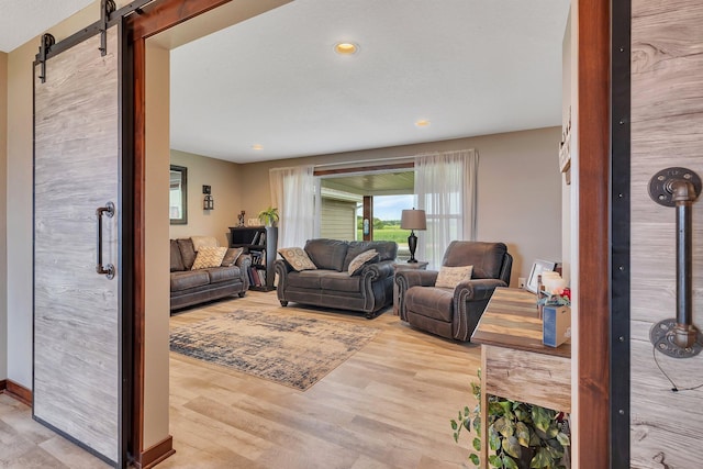 21048 Eagle Dr, Leslie Twp, MN 56360 - living room featuring wood finished floors, a barn door, and recessed lighting