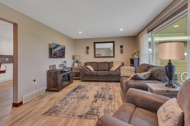 21048 Eagle Dr, Leslie Twp, MN 56360 - living area featuring light wood finished floors, baseboards, and recessed lighting