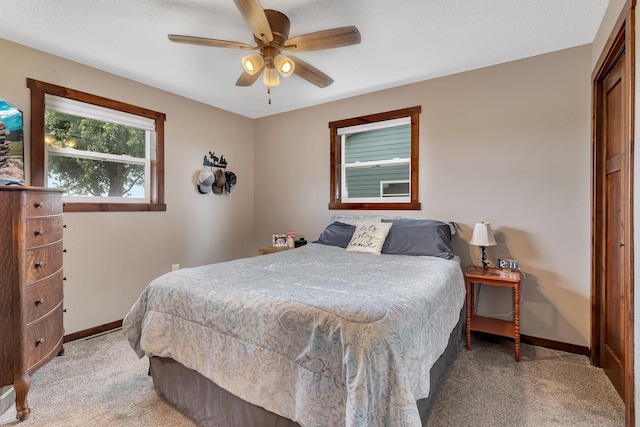 21048 Eagle Dr, Leslie Twp, MN 56360 - bedroom featuring light carpet, baseboards, and ceiling fan