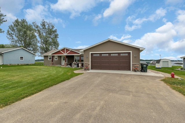 21048 Eagle Dr, Leslie Twp, MN 56360 - view of front of house with a front yard, driveway, and stone siding