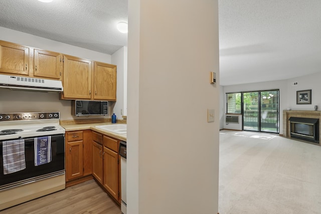 7625 Edinborough Way Unit 2116, Edina, MN 55435 - kitchen with white appliances, range hood, a textured ceiling, light countertops, and open floor plan