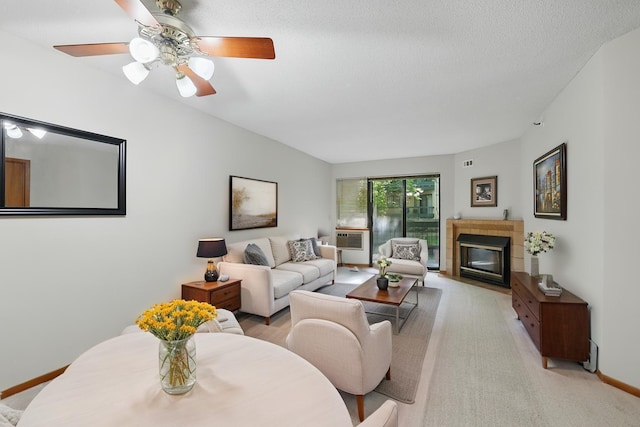 7625 Edinborough Way Unit 2116, Edina, MN 55435 - living area with a fireplace, baseboards, a ceiling fan, light colored carpet, and a textured ceiling