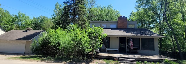 3114 Brooks Ln, Minnetonka Beach, MN 55391 - view of front of house featuring a chimney, a sunroom, and a garage