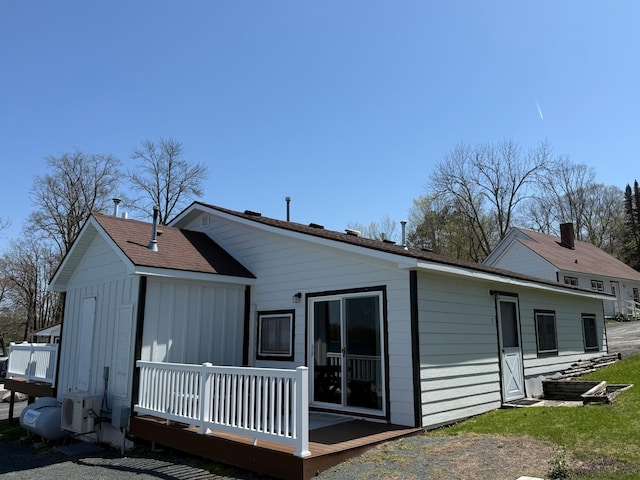 CABIN5 Gruenhagen Rd, Long Lake Twp, WI 54817 - rear view of property featuring a wooden deck, ac unit, and board and batten siding