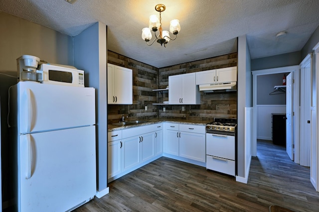 CABIN5 Gruenhagen Rd, Long Lake Twp, WI 54817 - kitchen featuring white appliances, under cabinet range hood, a sink, a chandelier, and white cabinets