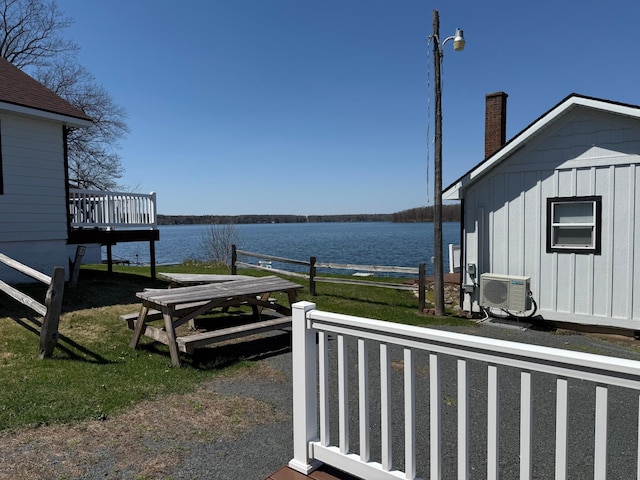 CABIN5 Gruenhagen Rd, Long Lake Twp, WI 54817 - view of yard featuring a cooling unit and a deck with water view