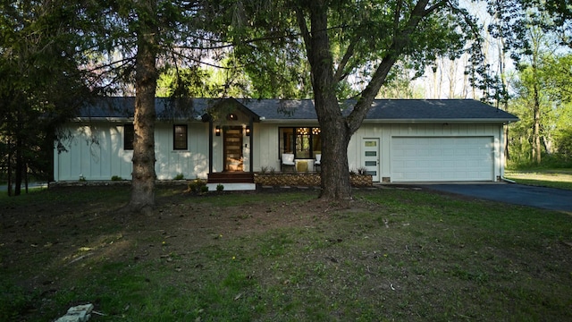 1795 Nolan Ave N, West Lakeland Twp, MN 55082 - ranch-style house with asphalt driveway, an attached garage, and board and batten siding