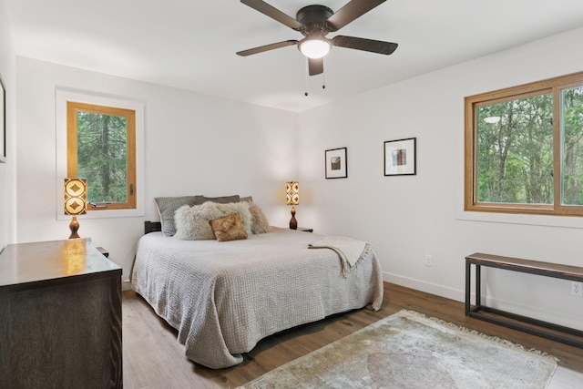 1795 Nolan Ave N, West Lakeland Twp, MN 55082 - bedroom with wood finished floors, baseboards, and ceiling fan