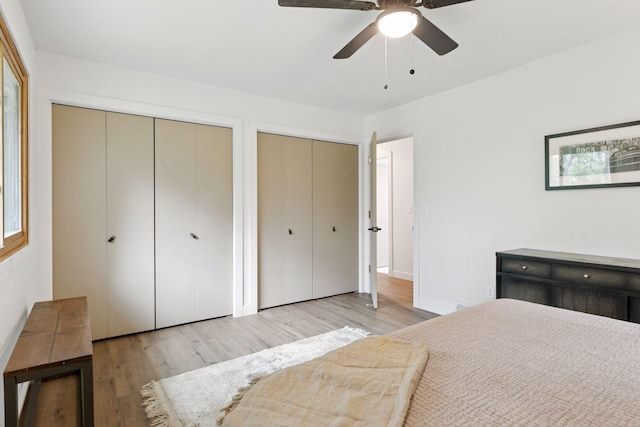 1795 Nolan Ave N, West Lakeland Twp, MN 55082 - bedroom featuring multiple closets, wood finished floors, and a ceiling fan