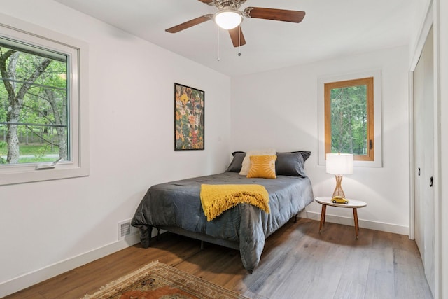 1795 Nolan Ave N, West Lakeland Twp, MN 55082 - bedroom featuring light wood-style flooring, baseboards, and a ceiling fan