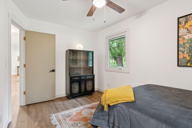 1795 Nolan Ave N, West Lakeland Twp, MN 55082 - bedroom featuring wood finished floors, a ceiling fan, and baseboards