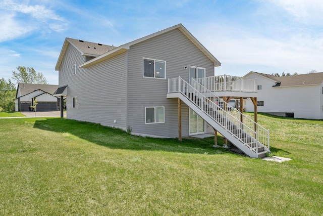 1129 Tiger Ct NE, Isanti, MN 55040 - back of house with stairway, a deck, and a lawn