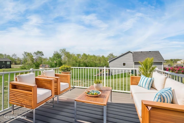 1129 Tiger Ct NE, Isanti, MN 55040 - wooden terrace featuring an outdoor living space and a lawn