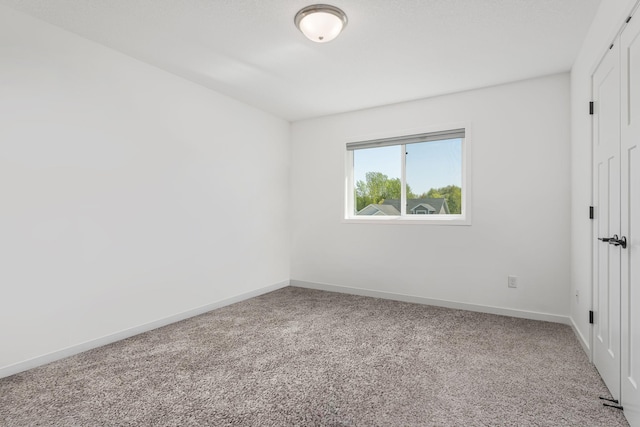 1129 Tiger Ct NE, Isanti, MN 55040 - unfurnished bedroom featuring carpet flooring, baseboards, and a closet