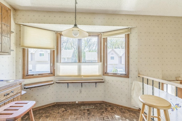 1567 Bavarian Pass, Fridley, MN 55432 - unfurnished dining area featuring wallpapered walls and baseboards