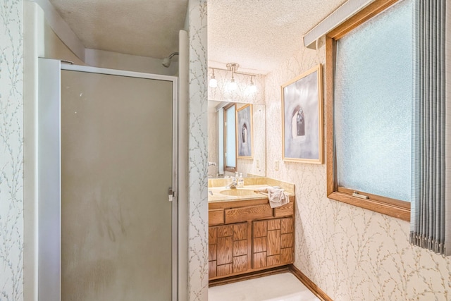 1567 Bavarian Pass, Fridley, MN 55432 - full bathroom with a stall shower, wallpapered walls, vanity, and a textured ceiling