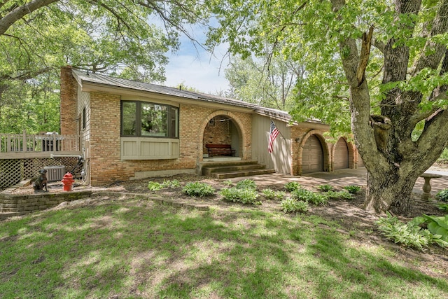 13640 Alamo St NE, Ham Lake, MN 55304 - view of front of home featuring brick siding, concrete driveway, an attached garage, and metal roof