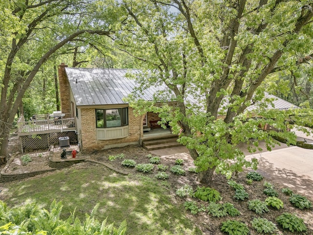 13640 Alamo St NE, Ham Lake, MN 55304 - view of yard featuring central AC unit and a wooden deck
