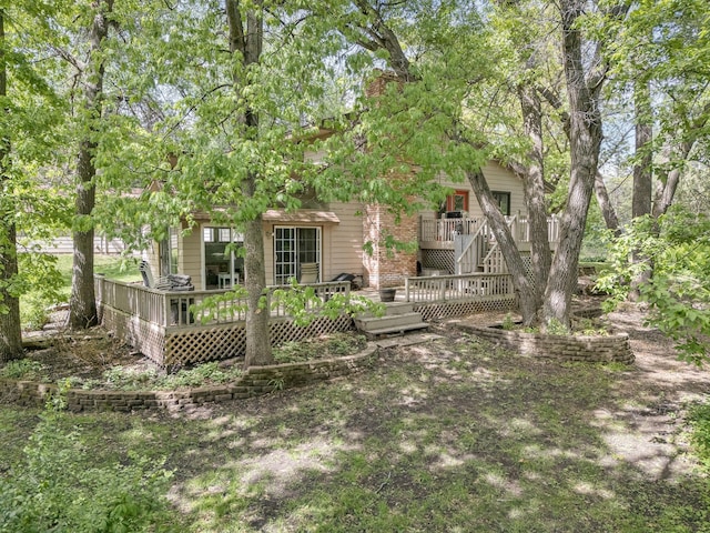 13640 Alamo St NE, Ham Lake, MN 55304 - back of property featuring a deck and a chimney