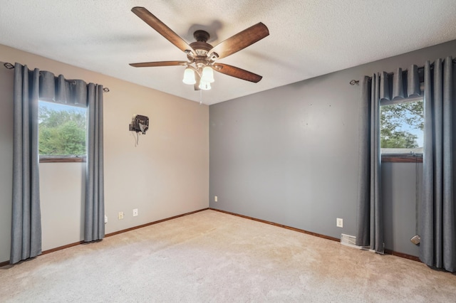22800 401st Ave, Arlington Twp, MN 55307 - empty room featuring a ceiling fan, carpet, baseboards, and a textured ceiling