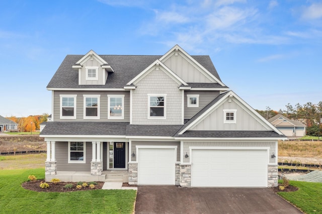 craftsman-style home with board and batten siding and a shingled roof