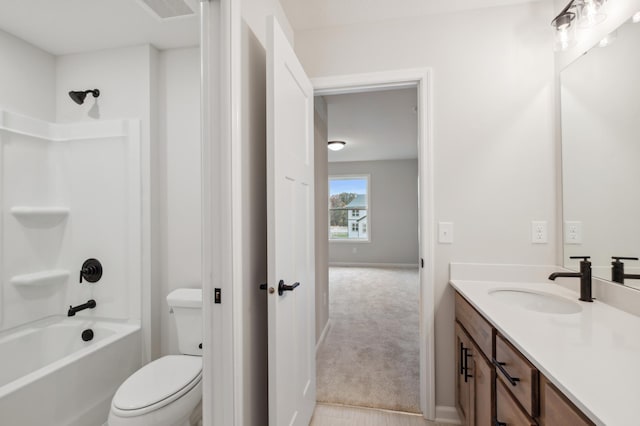 full bathroom with vanity, toilet,  shower combination, and baseboards