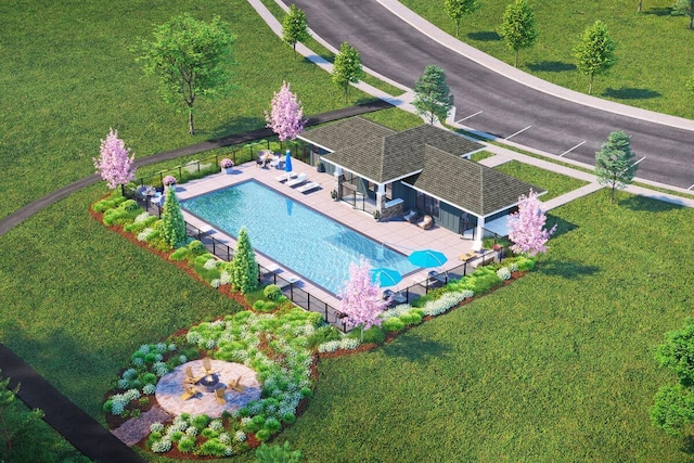 aerial view of property and surrounding area featuring a pool