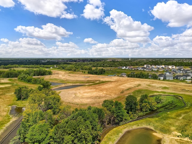 aerial view of residential area with a nearby body of water