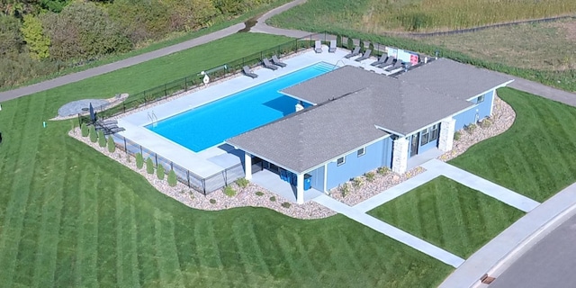 aerial view of property and surrounding area with a pool