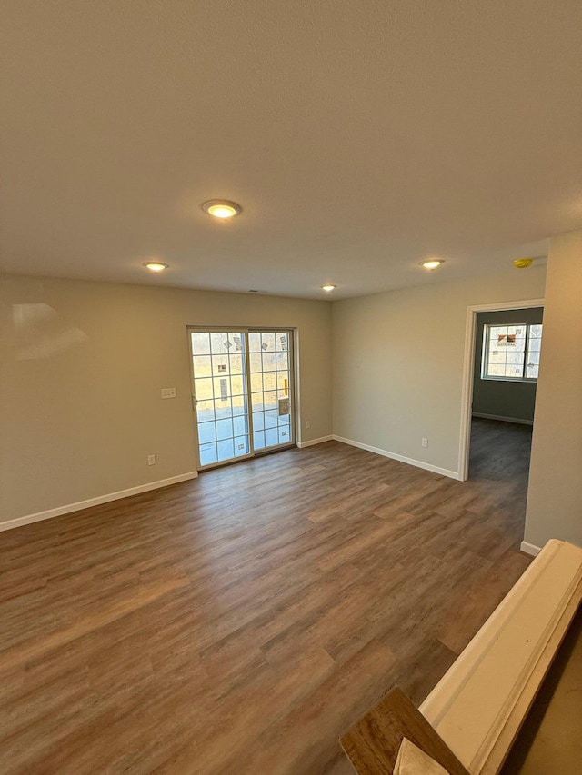 6809 Hamilton Park NW Unit 12, Bemidji, MN 56601 - spare room featuring recessed lighting, baseboards, and dark wood-style floors