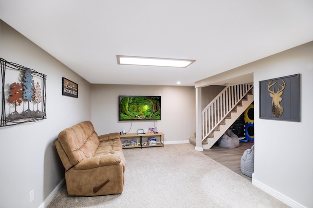 726 17th St NE, Owatonna, MN 55060 - living area with stairs, carpet flooring, and baseboards