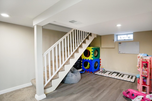 726 17th St NE, Owatonna, MN 55060 - recreation room with recessed lighting, wood finished floors, and baseboards