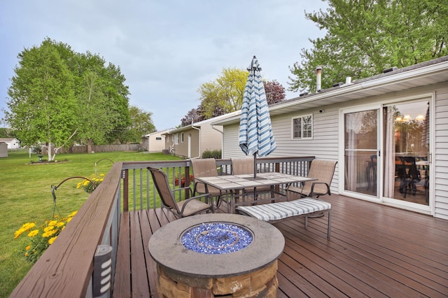 726 17th St NE, Owatonna, MN 55060 - deck with outdoor dining space and a yard