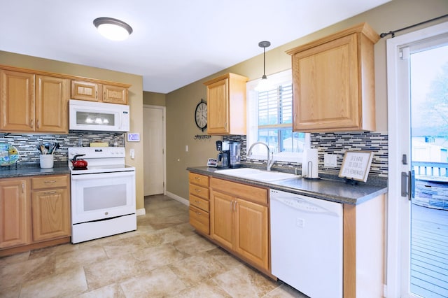 726 17th St NE, Owatonna, MN 55060 - kitchen with white appliances, a sink, decorative backsplash, and dark countertops