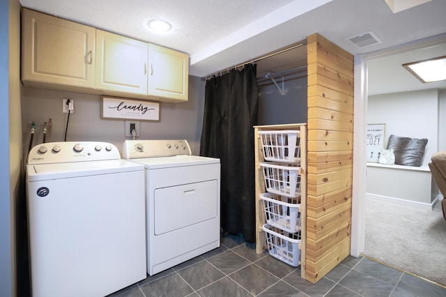 726 17th St NE, Owatonna, MN 55060 - clothes washing area featuring washing machine and dryer, cabinet space, dark carpet, and dark tile patterned flooring