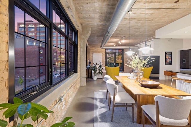 dining area with concrete floors