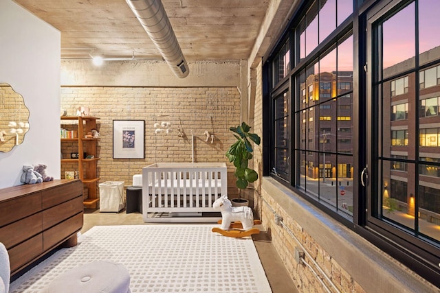 bedroom with brick wall