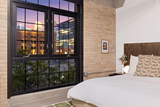 bedroom with brick wall