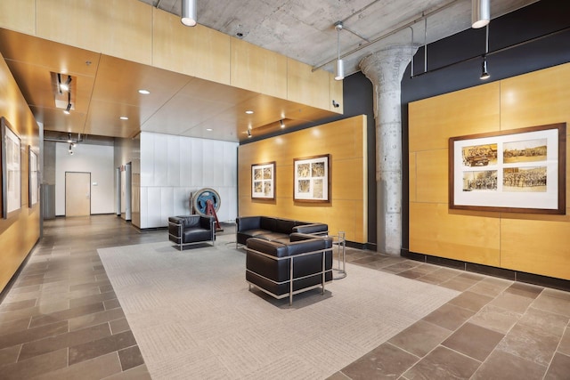 common area with a towering ceiling