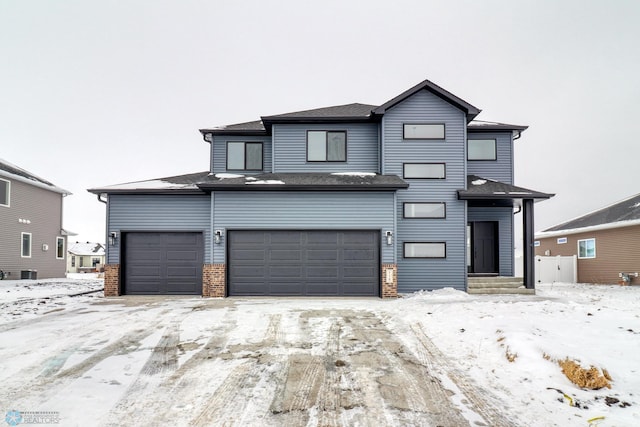 view of front of property with brick siding, a garage, and cooling unit